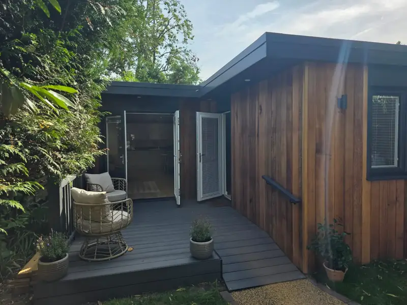 One bed-room garden annexe clad in Canadian western red cedar with grey composite deck